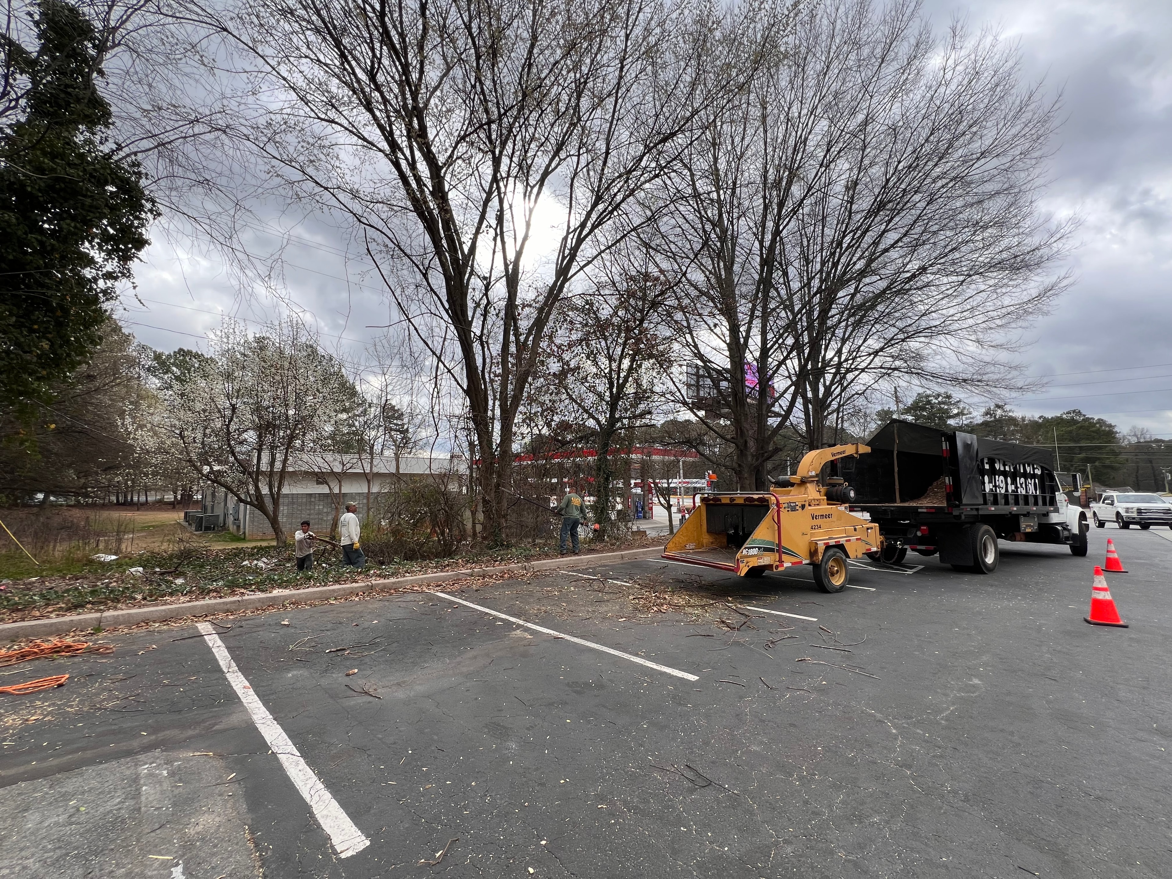 J&J's crew with wood chipper truck on commercial job