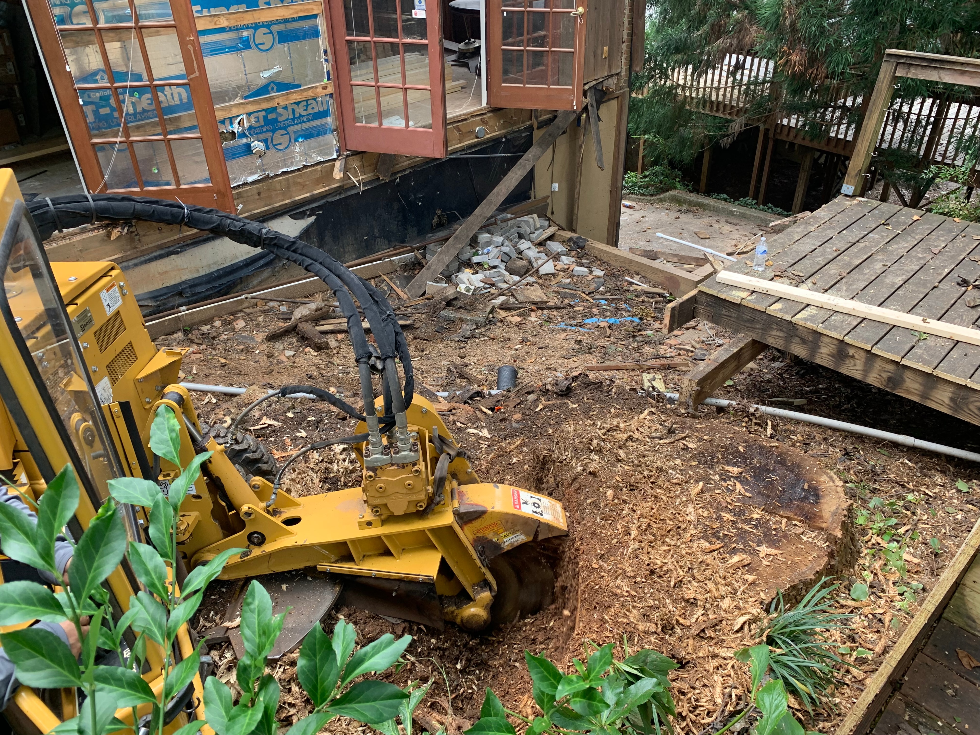 Stump grinding equipment in action at a residential property